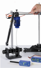 Complete experimental setup showing coil wand mounted on RMS with horseshoe magnet and sensors